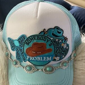 Women’s Custom Made Somebody's Problem Embroidered Trucker Hat in Aqua & White